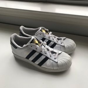 Black and white adidas superstar sneakers